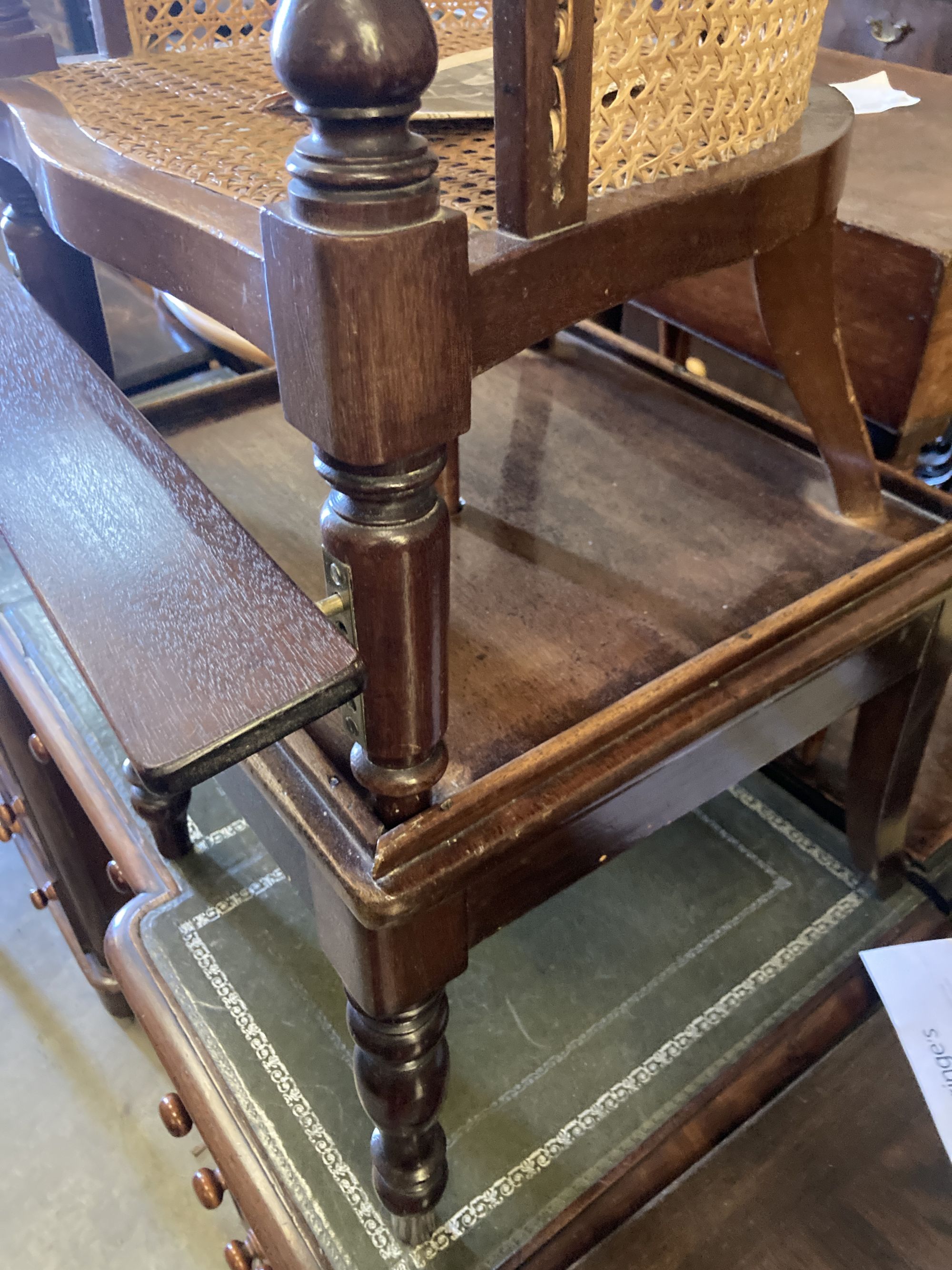 An early Victorian caned mahogany childs high chair on stand, width 42cm, depth 42cm, height 94cm